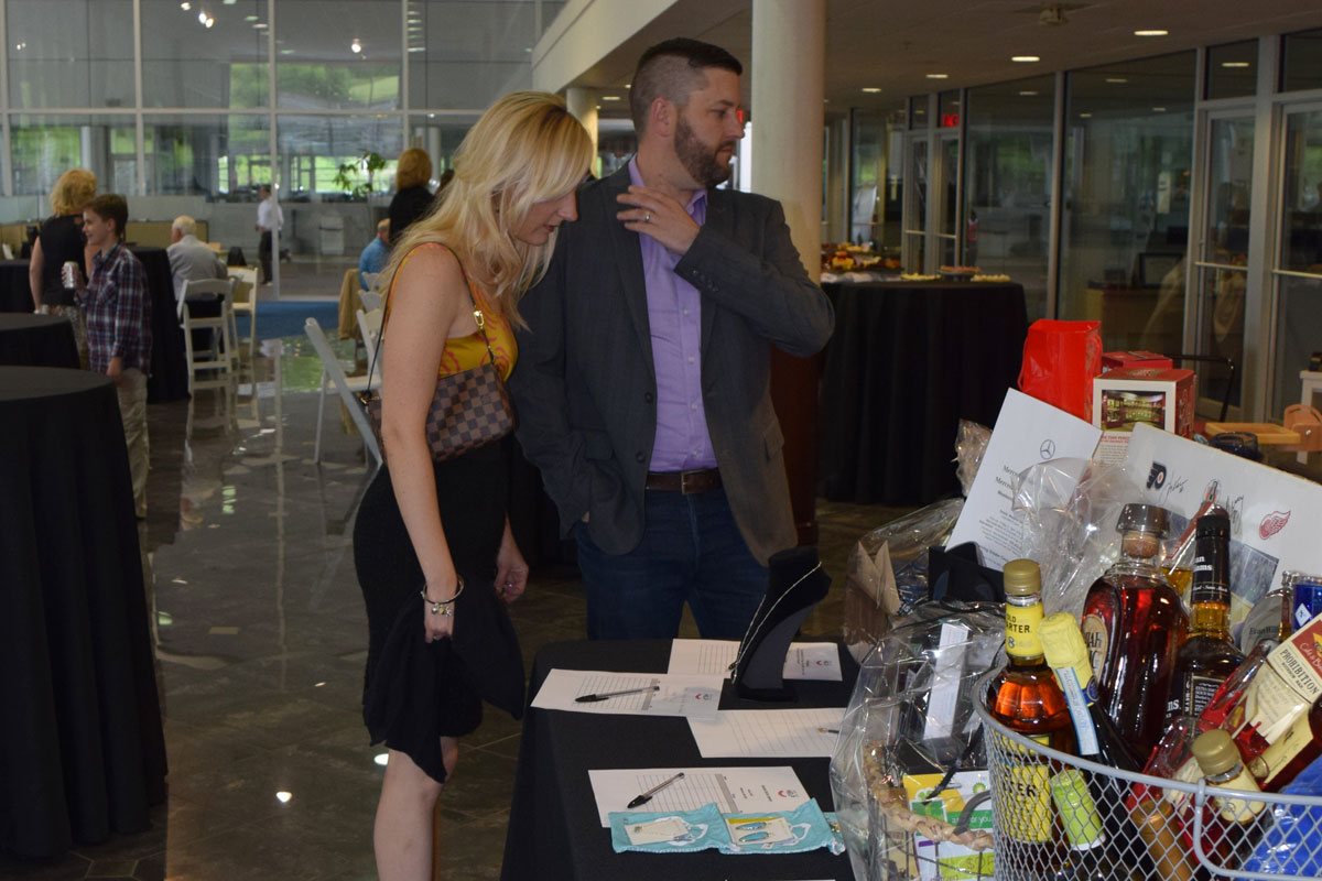 Couple checking the gift basket raffle